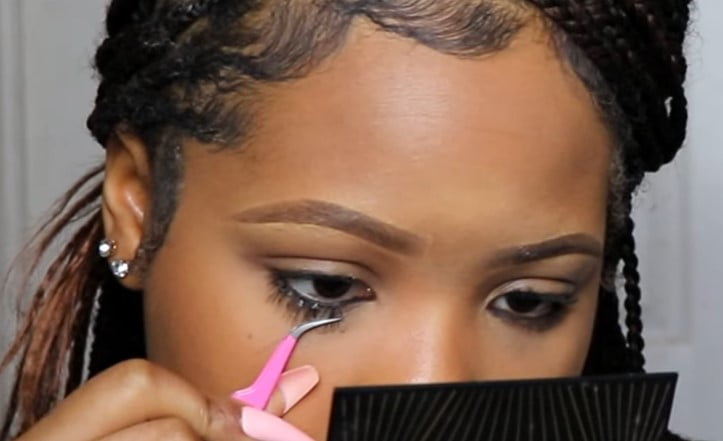 Lower lash extension: step 3, dip the extension in adhesive and apply it as you would for the upper lashes