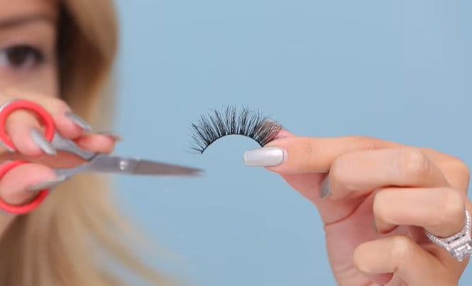 How to trim eyelashes: step 4, cut your fake lashes with a pair of lash scissors